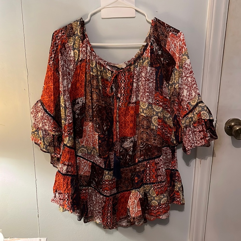 Shirt with patch work pattern, orange, black and burnt orange,size 1x.